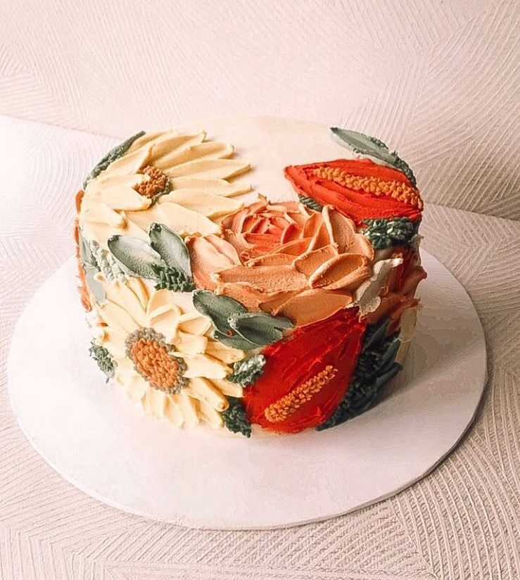 Senna. A flower designed cake in red, orange, beige mixed colors. The cake has dimensions of 6 inches in diameter and 3-4 inches in height