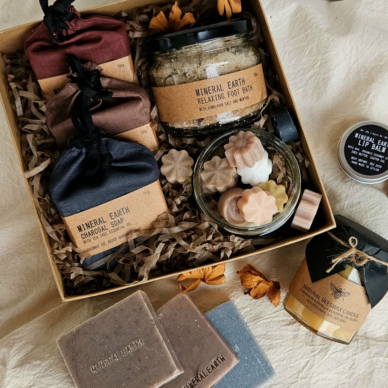 Gift a loved one a curated selfcare gift box This pack includes; 3 bars of soap, Foot soak (250g), Hair oil (250ml), Mini blocks jar (12) and Soy Wax Candle.