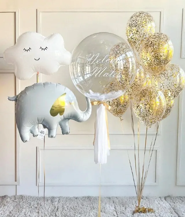 Create a memorable balloon arrangement for your special occasion! 1 helium Cloud 1 helium Elephant 1 Personalized bubble Balloon 9 Confetti helium latex Balloons Color theme and wording can be customized
