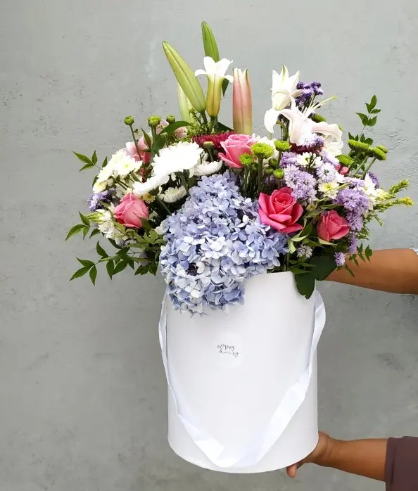 Gift your loved ones a beautiful flower arrangement of Lillies, Roses, Hydrangeas, Chrysanthemums and Foliage