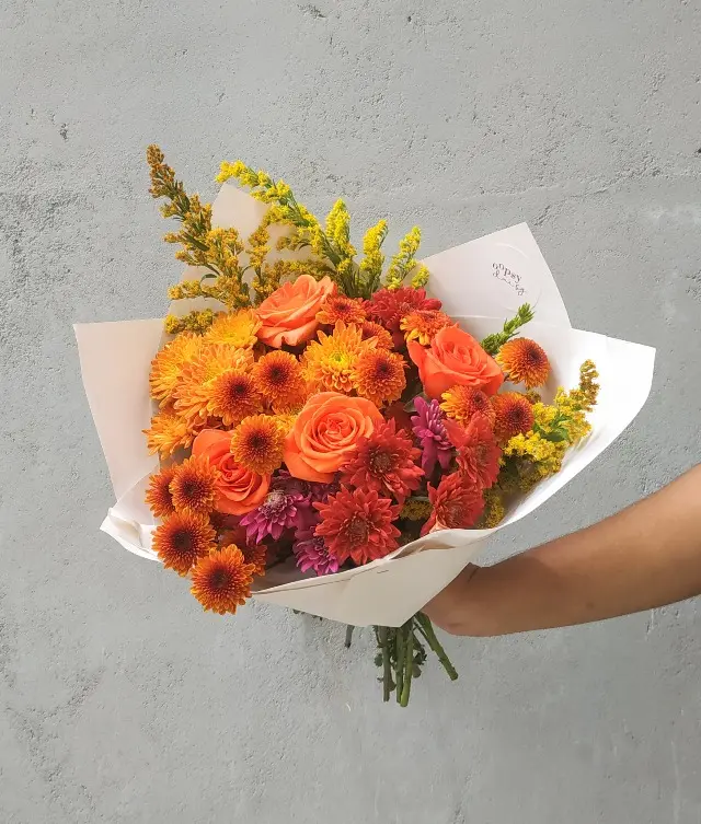 Gift your loved ones a beautiful bouquet of orange flowers to show you care.