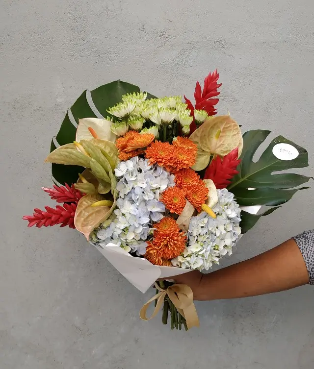 Gift your loved ones a beautiful flower bouquet of anthuriums, hydrangeas, chrysanthemums, and tropical flowers