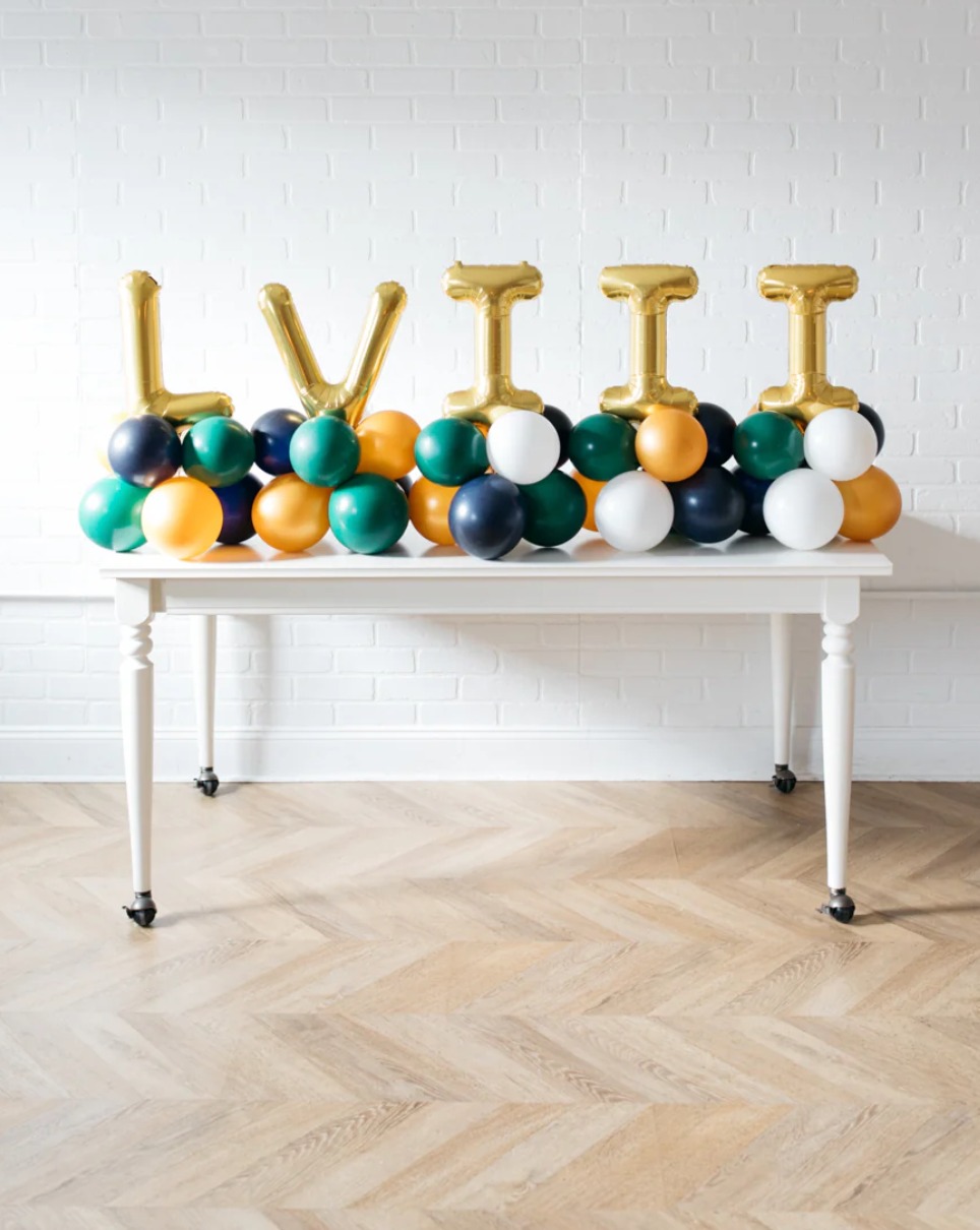 This arrangement includes six foil letter balloons (not helium) and latex balloons. The balloon color theme and letters can be customized to your preference. Foil letters are available in Gold, Silver, and Rose Gold, and they are 16” in size.