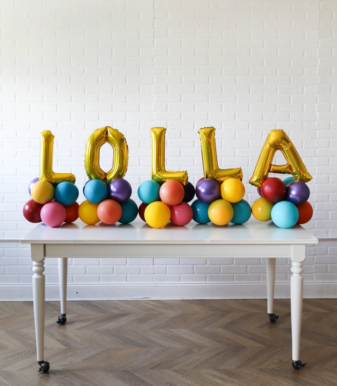 This arrangement includes six foil letter balloons (not helium) and latex balloons. The balloon color theme and letters can be customized to your preference. Foil letters are available in Gold, Silver, and Rose Gold, and they are 16” in size.