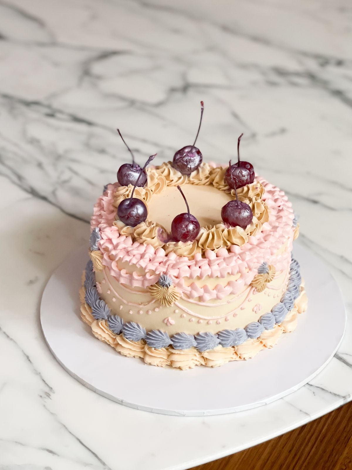 Gift your loved one a ribbon cake topped with maraschino cherries and edible glitter! The cake measures 6 inches in diameter and 4–5 inches in height, making it a perfect treat for any special occasion.