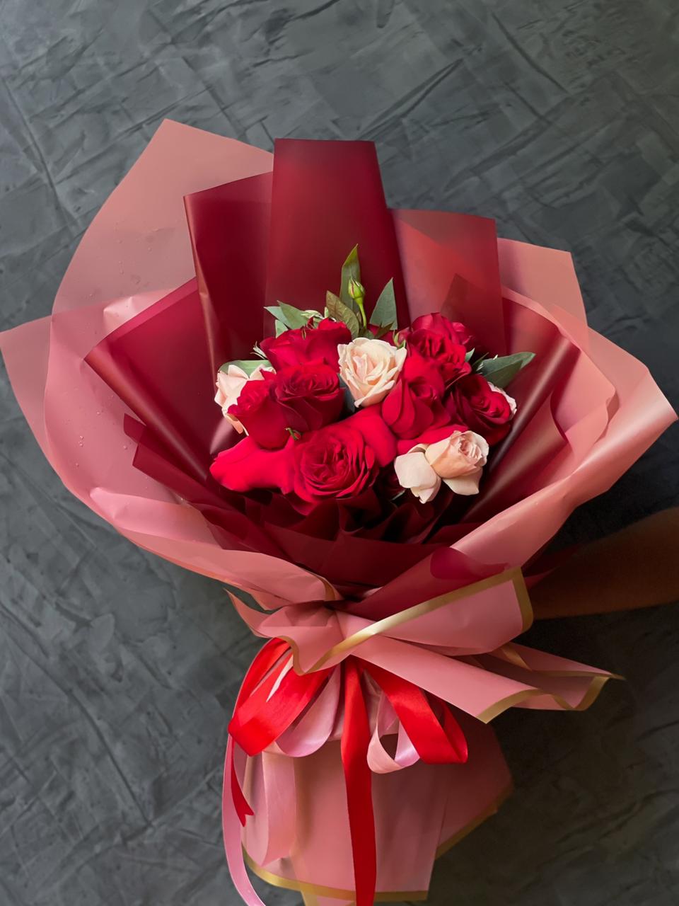 Express your love and admiration with a stunning bouquet of 12 exquisite roses in a romantic blend of pink and red. Symbolizing passion, affection, and heartfelt emotions, this elegant arrangement is perfect for making any moment special. A timeless gesture of love and appreciation