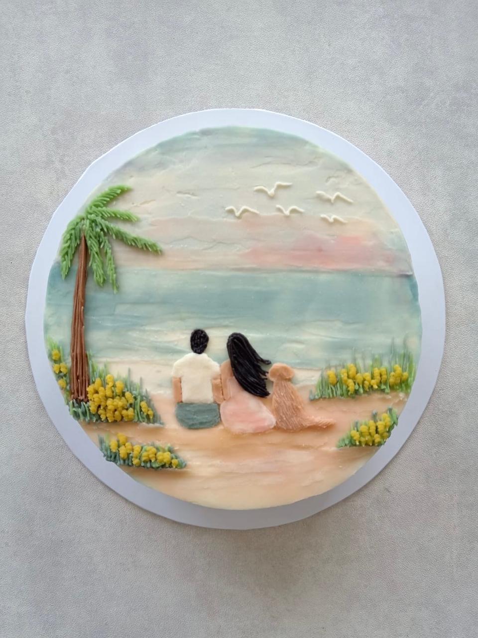 Drawing cake. design with a boy, girl and a dog sitting in a beach