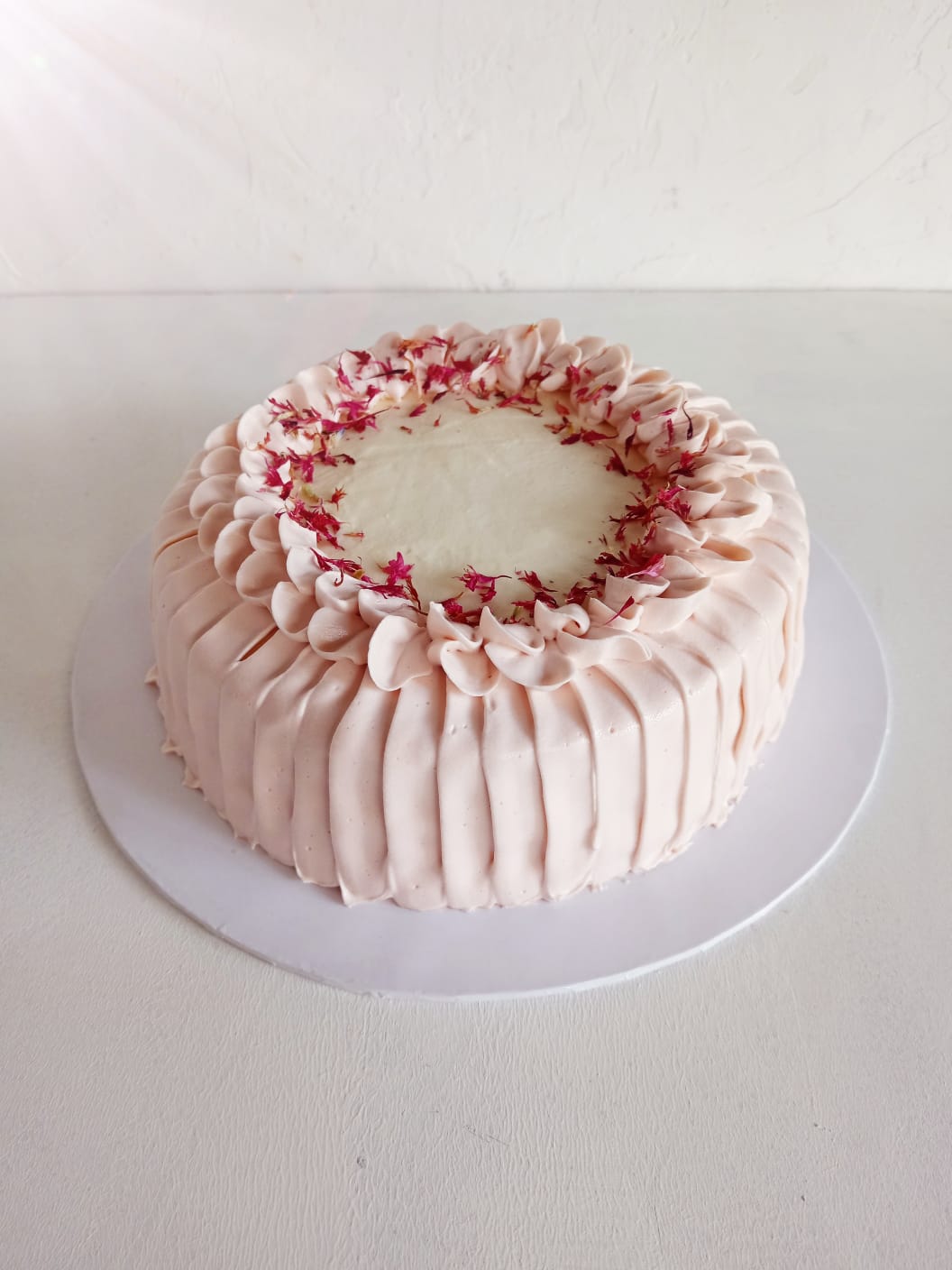 Vanilla Rhubarb Strawberry Delight – Fluffy vanilla sponge layered with tangy rhubarb & strawberry compote, finished with luscious Italian meringue cream cheese frosting. A perfect balance of sweet and tart! Measuring 7 inches in diameter and 3-4 inches in height.